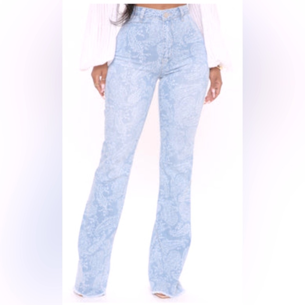 Denim bell bottom jean with detailed design.